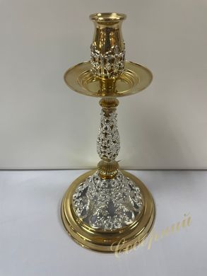 Brass candlestick with gilding fragment.