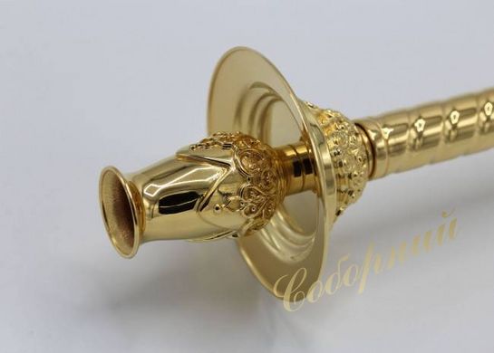 Deacon's hand-held brass candlestick in gilt with inlays