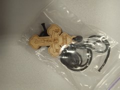 Worn wooden cross on a string (3-4 cm)