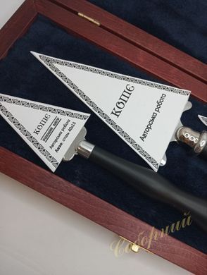 A set of pens in a wooden case