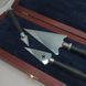 A set of pens in a wooden case