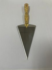 A large brass spear with gilded inlays.